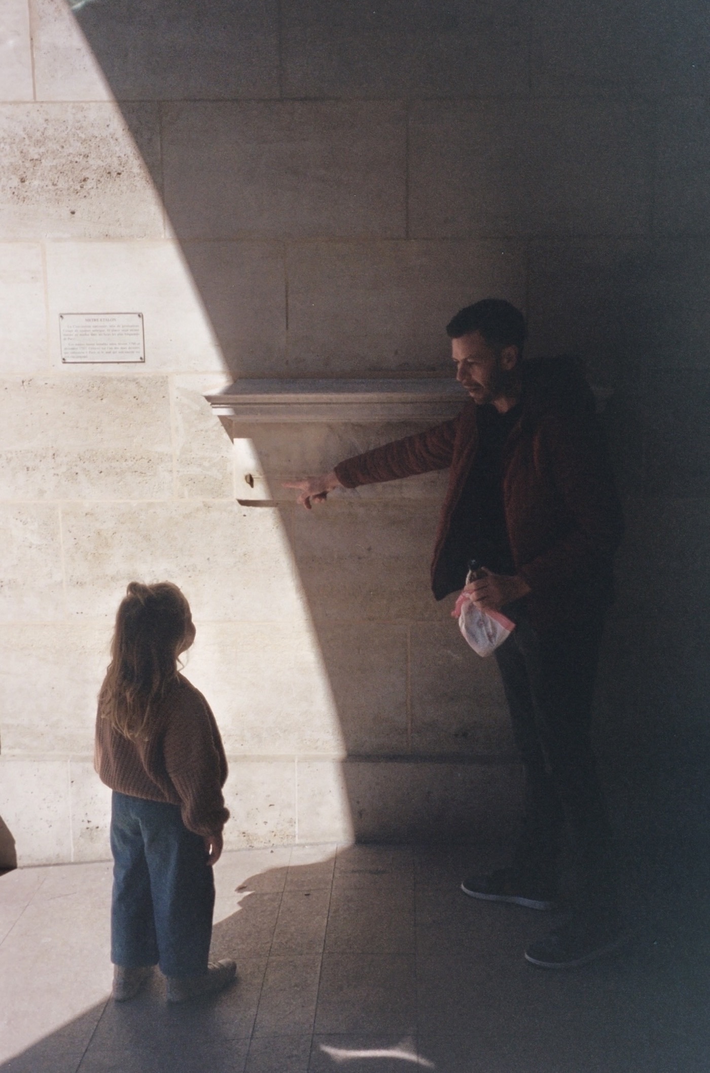Ash Punch showing Luna the original metre in Paris. Photo taken with Leica Z2X in Paris by Josh Withers.