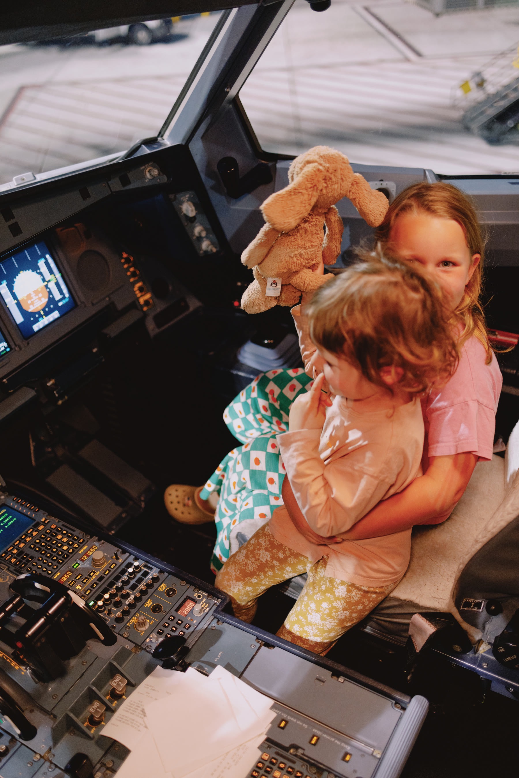 My daughters in the A330 flight deck after flying QF15 from Brisbane to Los Angeles